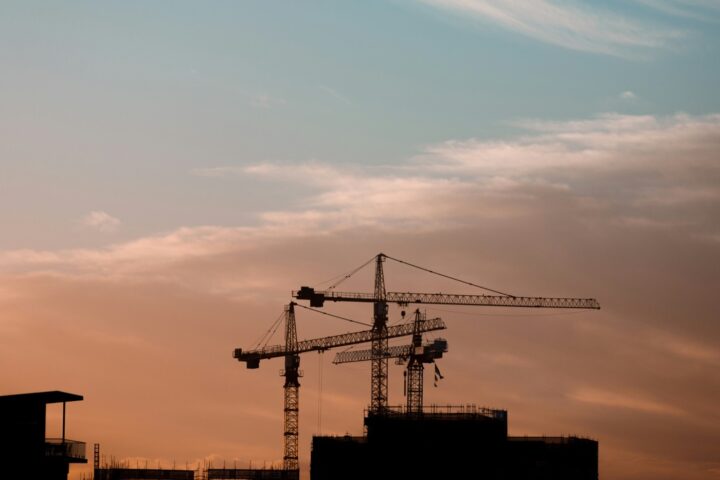 https://unsplash.com/photos/three-tower-cranes-a7xke_rxZRs